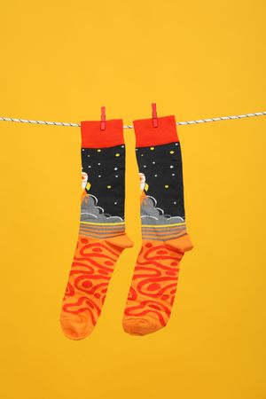 Casual clothes and wearing concept - socks, clothes for foot
