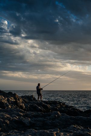 Man fishing at dusk in the Canary Islands