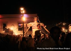 Large female effigy over street revelers in Oaxaca 0yBRq5