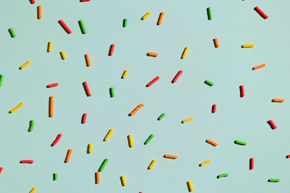 Pattern of Colorful Sprinkles with Hard Shadow on Mint Background,