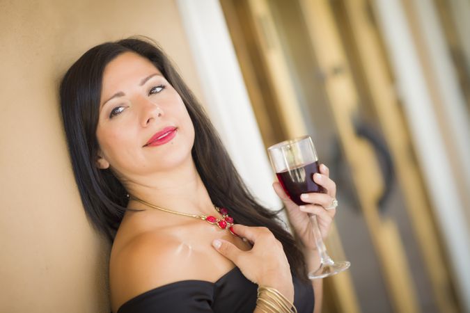 Hispanic Woman Portrait Outside Enjoying Wine
