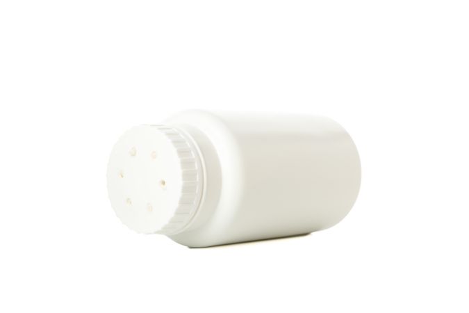 Blank bottle of talcum powder isolated on blank background