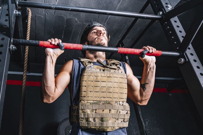 Hardworking male training in gym