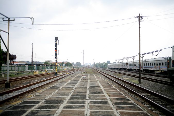 Train tracks and signals on overcast day