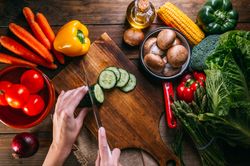 Vegetables and utensils on kitchen table