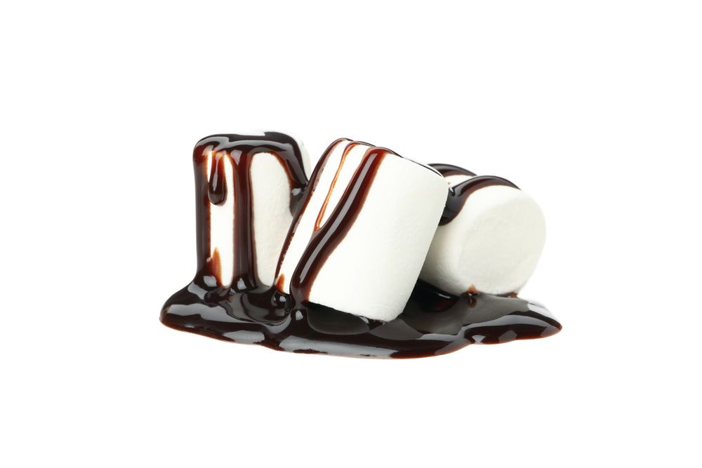 Marshmallow in chocolate sauce isolated on blank background