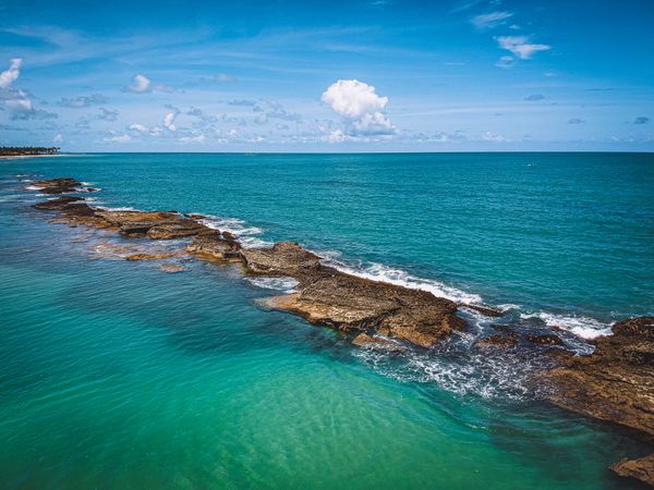 Rocky ridge in clear waters in Brazil