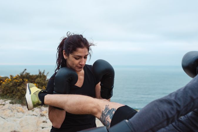 Boxers exercising on cliff