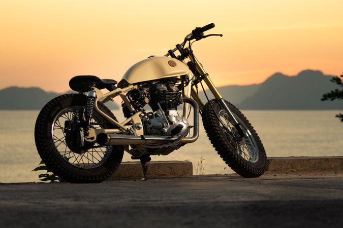 Motorbike near sea during sunset