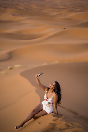 Woman taking selfie in desert