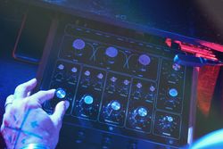 Unrecognizable man playing on DJ mixer