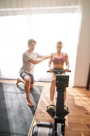 Woman doing exercises with personal trainer