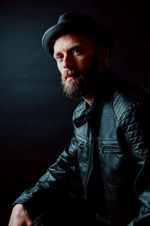 Young bearded guy in leather jacket