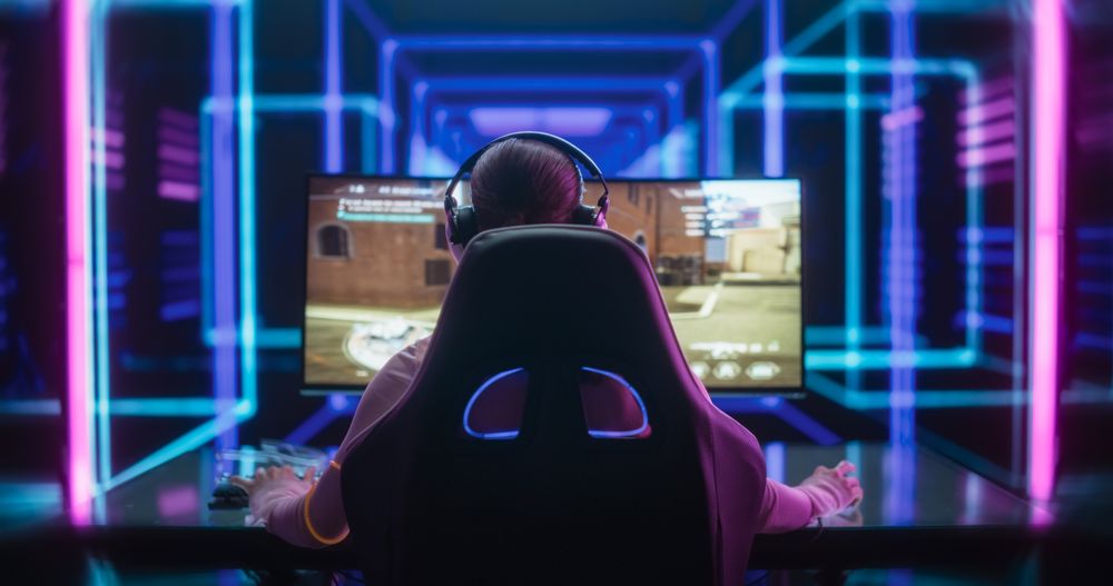 Young Female Professional Gamer Competing in an E-Sports Championship Event in a Futuristic Neon Arena.