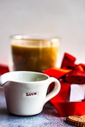 Creamer with the word "love" with cookies