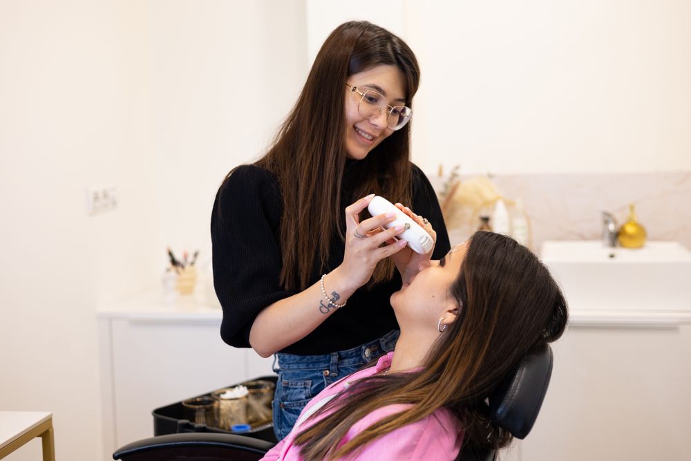 Beautician making eyelash lamination and dyeing procedures