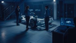 Team of Automotive Engineers Working on Electric Car Platform
