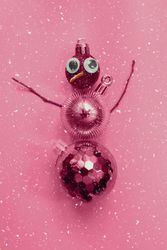 Pink snowman made out of Christmas decorations