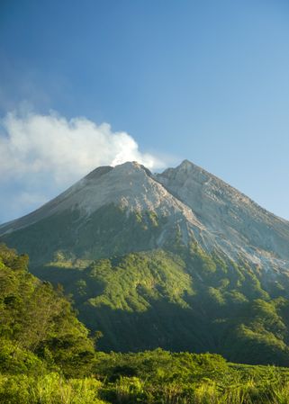 A portrait of merapi mountain in spring at Yogyakarta, Indonesia. With splendor and steam from the lava
