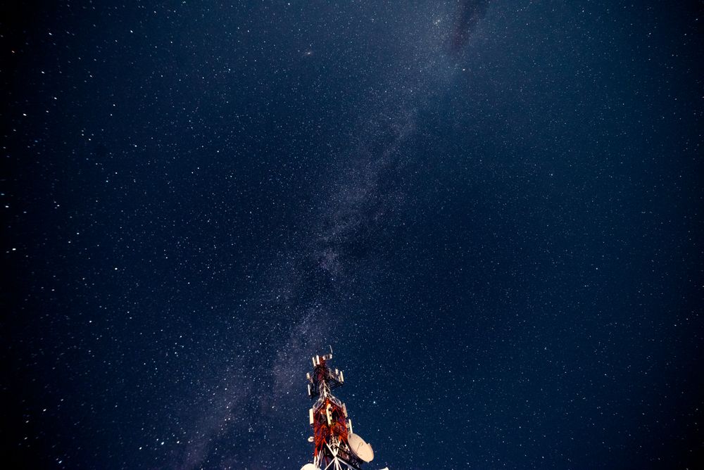Radio tower against starry sky