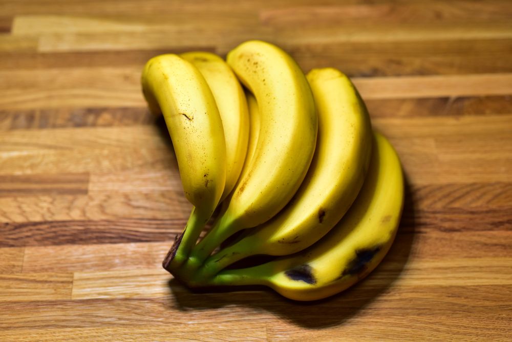 Yellow banana on a wooden table.