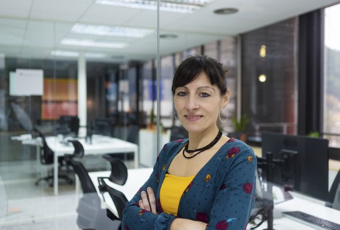 Confident businesswoman standing in office