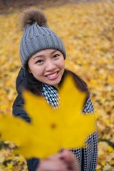 Happy female tourist enjoying autumn in Oslo