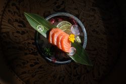 Salmon sashimi on banana leaf