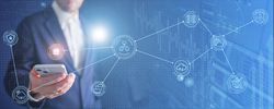Concept; implementing AI in all areas of life with man holding phone with digital web
