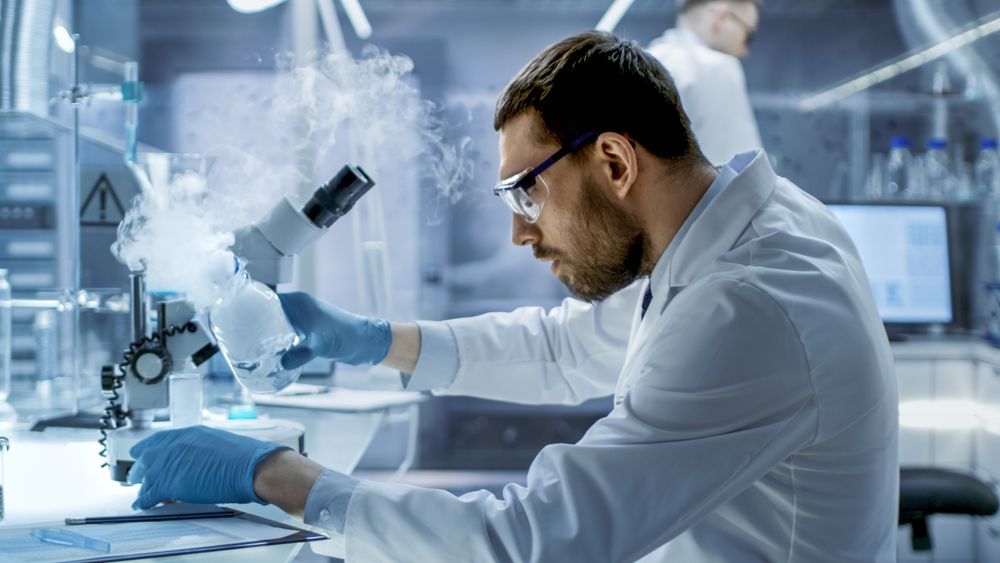 In a Chemical Research Laboratory Scientist Mixes Smoking Compounds in Beakers.