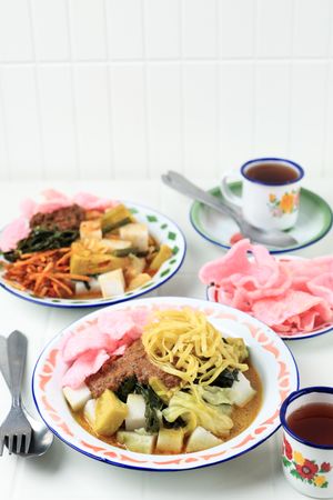 Pical or Katupek Pical with Lontong Sayur padang on Table.