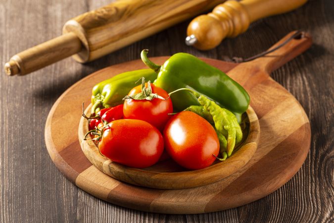 Wooden table with ingredients for pizza.