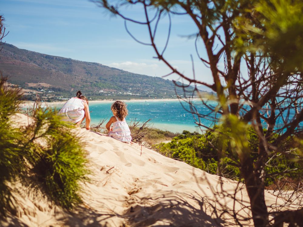 small girls having a stroll at beach