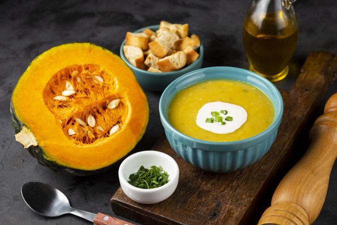 Bowl with pumpkin soup on the table.