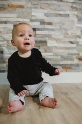 Baby sitting on floor at home