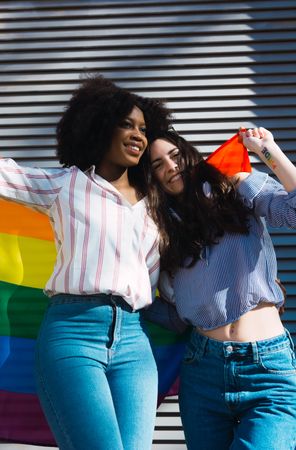 Lesbian couple with LGBT flag