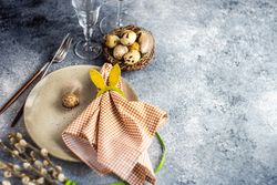 Easter table setting with eggs and rabbit napkin ring