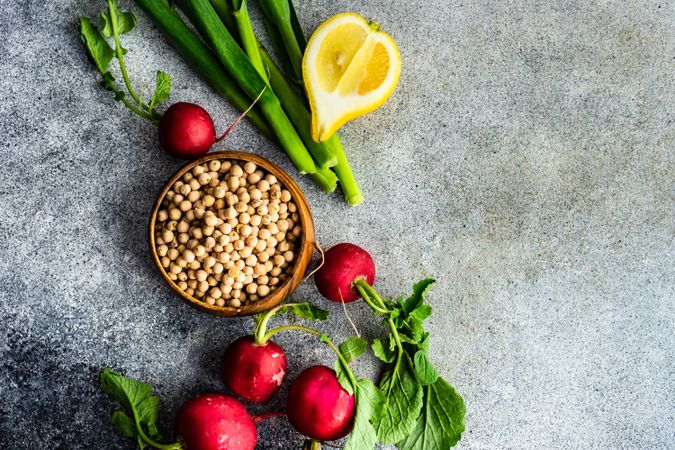 Fresh ingredients of radishes, lemon slices and chick peas