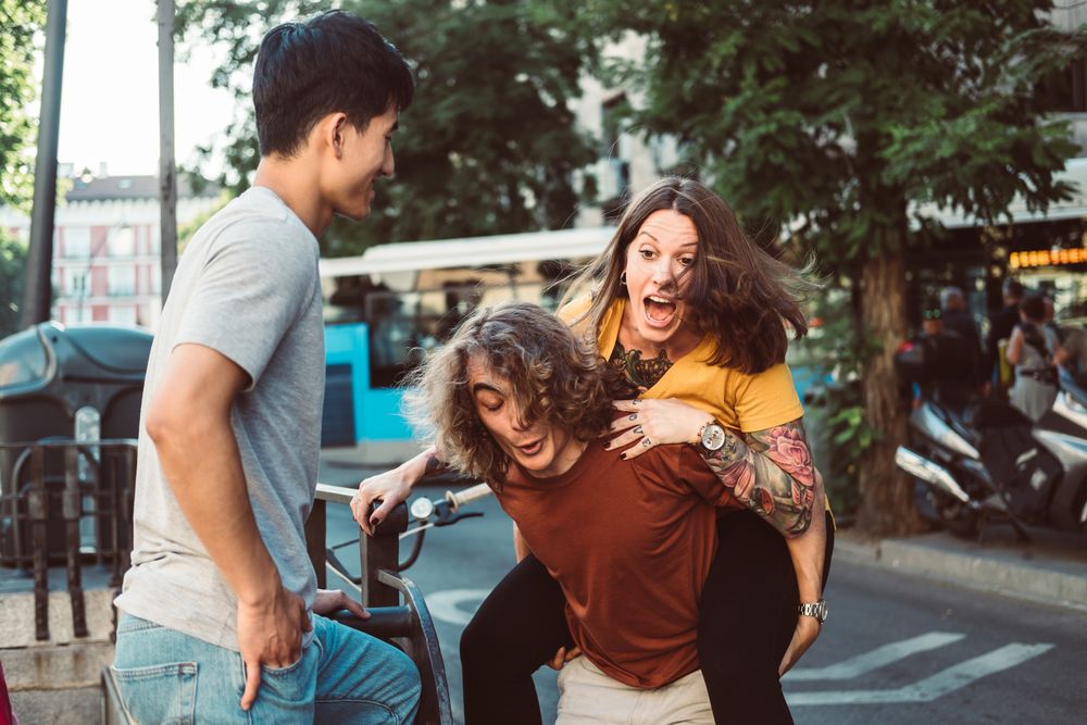 Carefree multiracial friends having fun on street