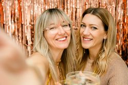 Cheerful women with glass of champagne