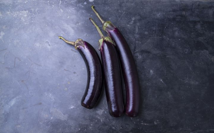Fresh eggplant on a concrete Floor