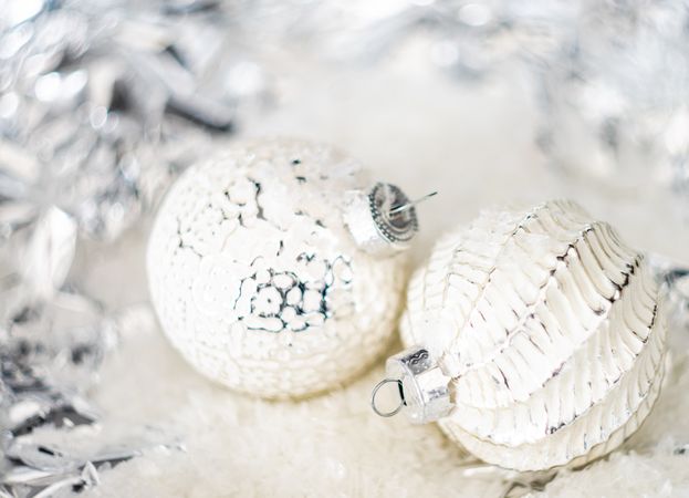 Christmas holiday baubles on silvery background