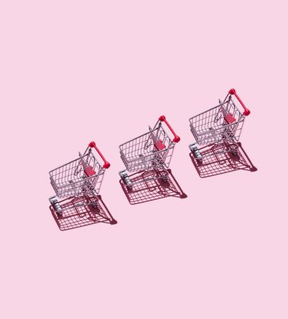 Three mini toy shopping carts