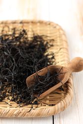 Bamboo trey and scoop of hijiki seaweed