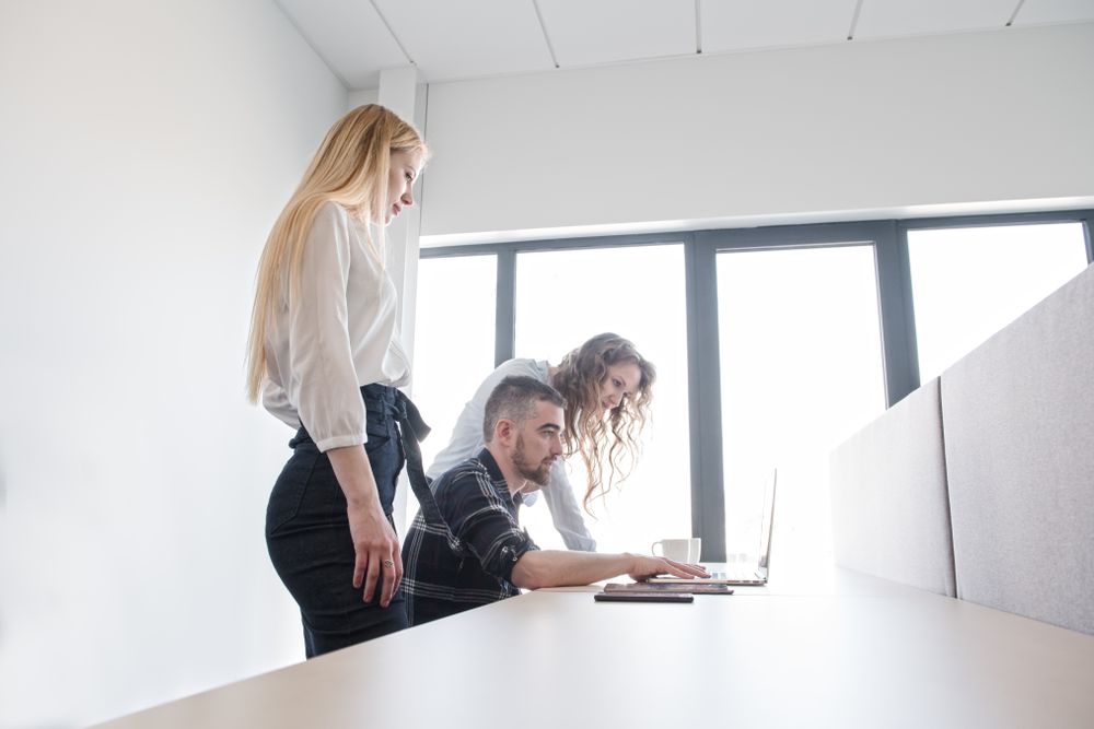 Group of colleagues working in contemporary office