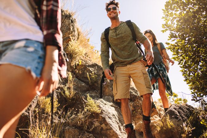 Skilled hikers following path through mountain hike