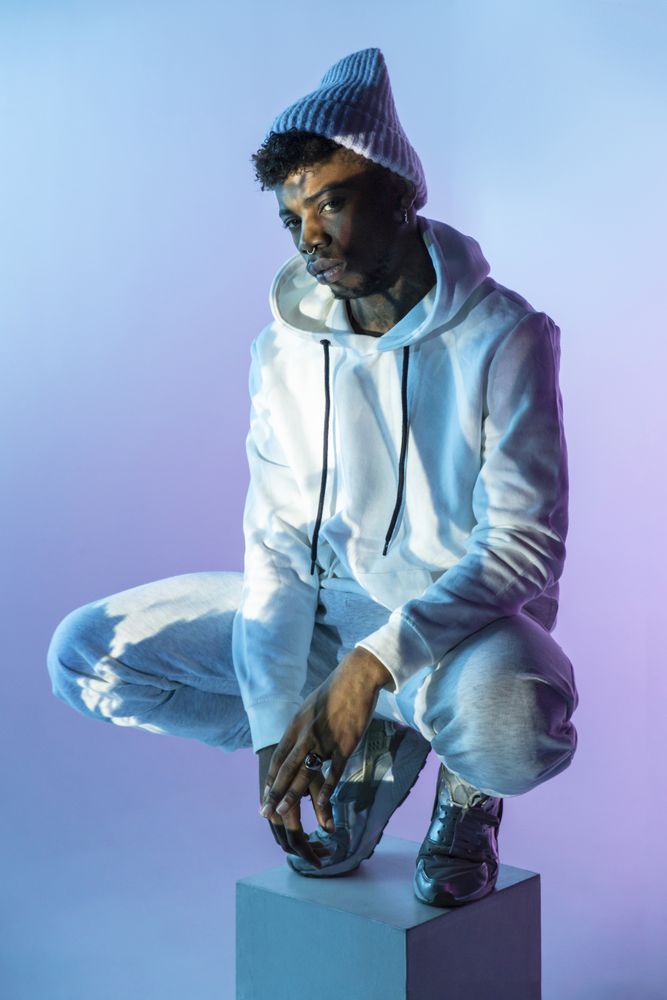 Stylish Black man on cube