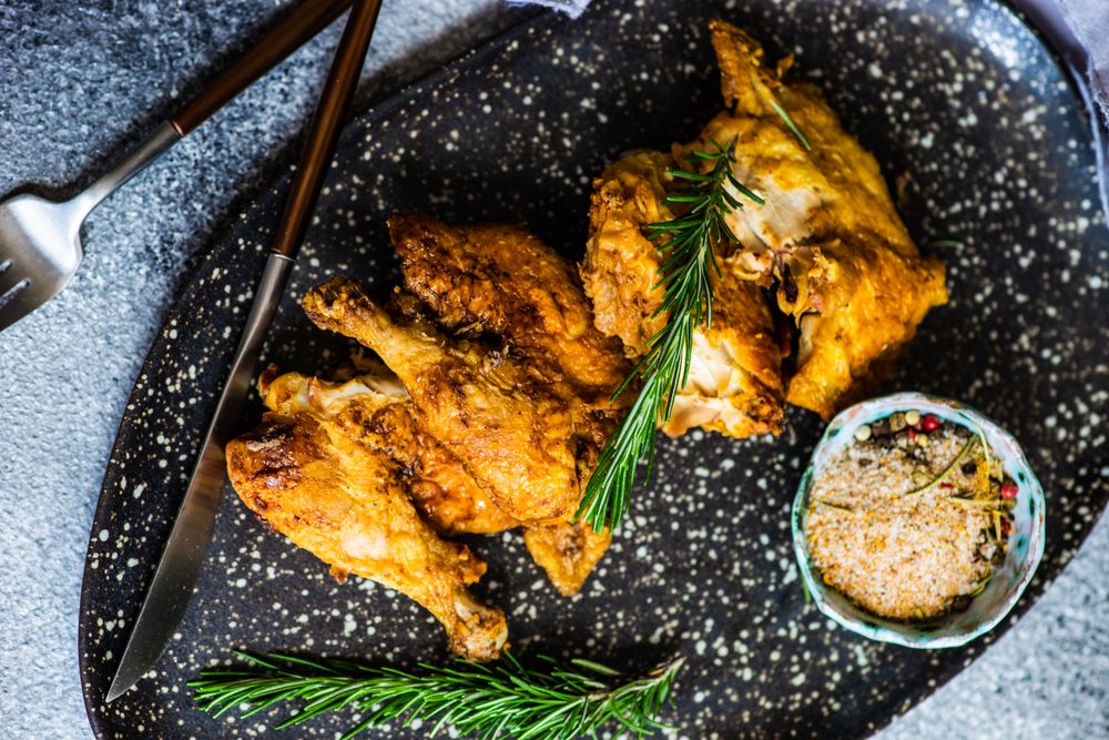 Top view of grilled chicken with rosemary