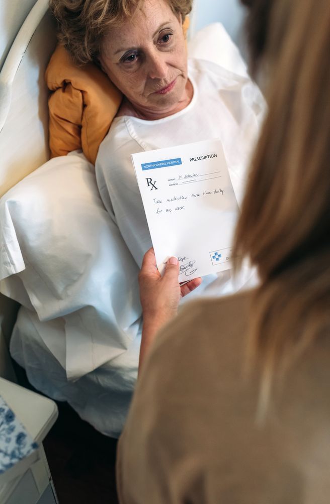 Doctor giving a prescription to older patient