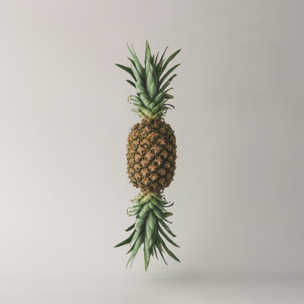 Candy made of ripe pineapple on light background